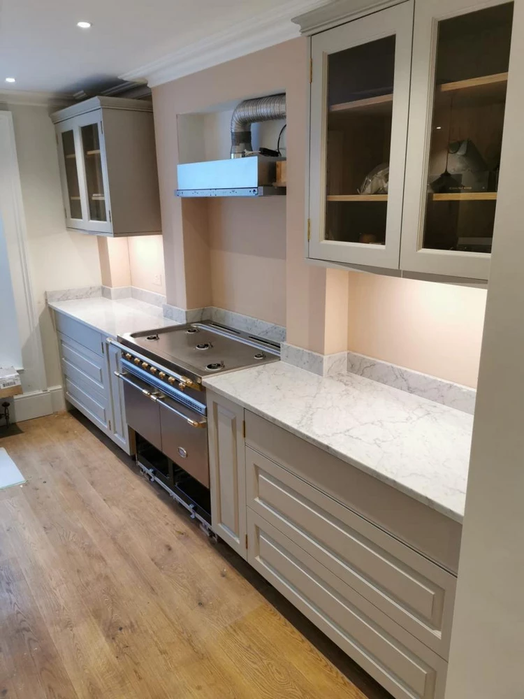 white kitchen cabinets with marble top